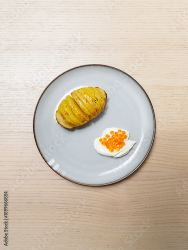 Wallpaper Mural A plate of baked potato with creme fraiche and salmon roe. Torontodigital.ca