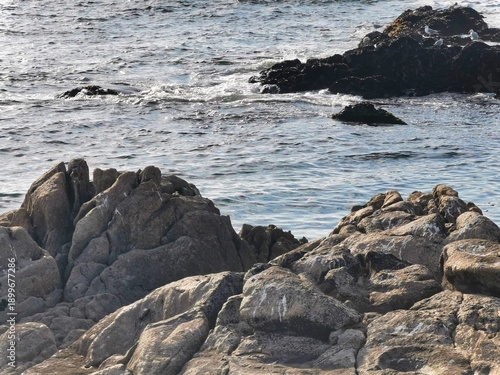 Beautiful scenery and relaxation. Rocks in water. Olas rompiendo en las rocas. Ocean with a birds eye wiew. The windy conditions create ideally large waves with a beautiful beach. Wave splash.