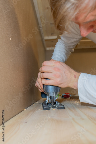 Close-Up of Drilling Wood During Furniture Assembly