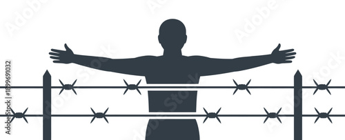 A silhouette of a man standing behind a barbed wire fence with outstretched arms