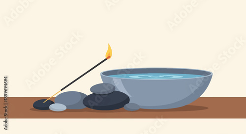A burning incense stick beside a bowl of water and smooth stones