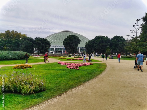 Park in the city. Golf hole on water. Garden with bending road path. Dutch farm at dusk with clouds in the sky. Park with statue. Wide shot of a golf course with a sand trap and water hazard.