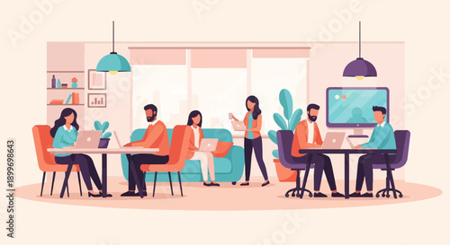 A group of people working together in a modern office space with laptops and computers