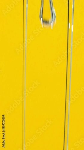 Abstract Background Flow Of Refined Oil On Yellow Background, Space For Text, Macro Texture