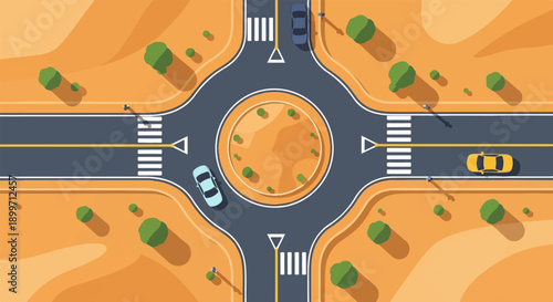 Aerial view of a roundabout intersection with cars, trees, and desert landscape