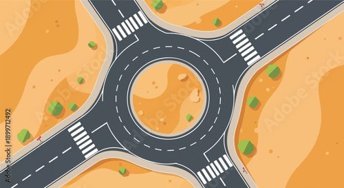 Aerial view of a modern roundabout with pedestrian crossings and desert landscaping