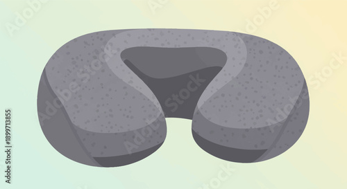 A soft, gray neck pillow with a textured surface on a gradient background