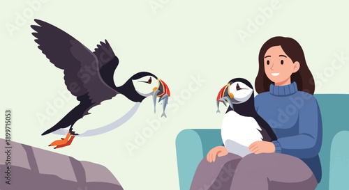 A woman on a sofa holds a puffin with fish while another flies nearby