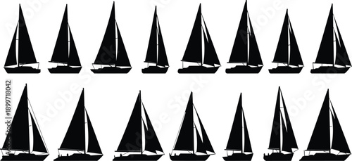 Silhouette of multiple sailboats on water