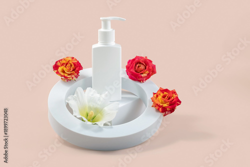  bottle of skin care cosmetics on a white catwalk and rose flowers on a beige background