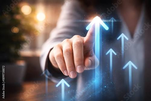 Business person pointing to upward growth arrows