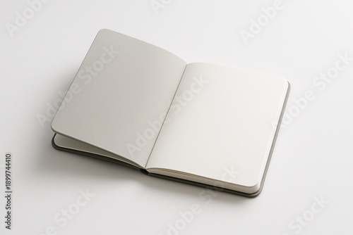Open Blank Notebook on White Background
