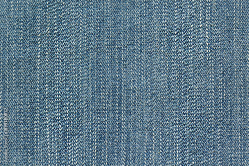 Fotografie Blue denim fabric texture with visible twill weave and classic textile pattern
