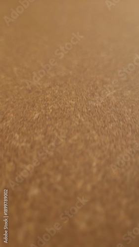 Warm brown leatherboard sheet surface with fine pressed fiber texture.