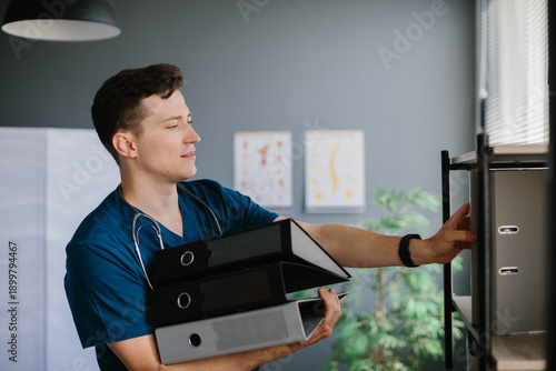Photography Doctor organizing patient records on office shelf