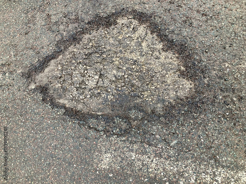 one sample of a pothole on a road
