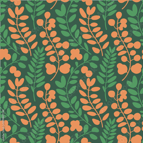 Vibrant orange and green leafy branches on dark background