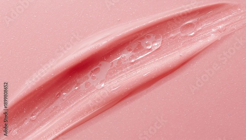 Soft Pink Paint Spread on a Surface in a Creative Workspace
