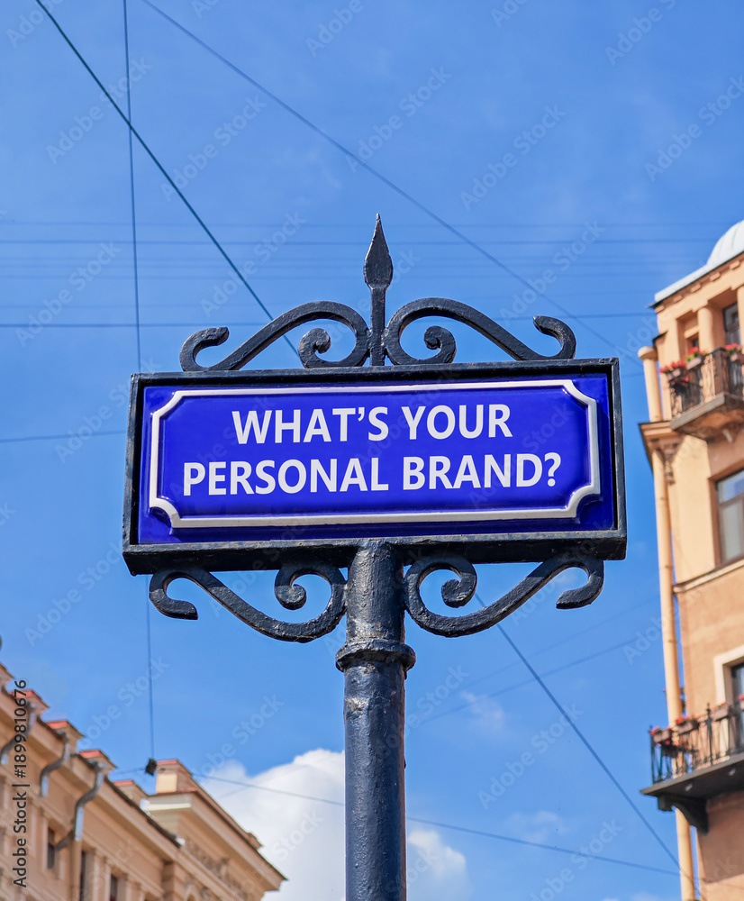 Obraz premium What is your personal brand symbol. Concept words What is your personal brand on beautiful blue road sign. Beautiful blue sky background. Business what is your personal brand concept Copy space
