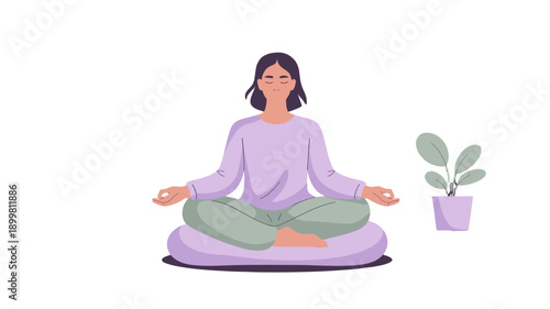 A woman meditates in a peaceful environment.