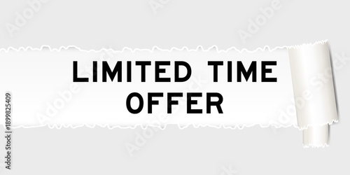 Ripped gray paper background that have word limited time offer under torn part