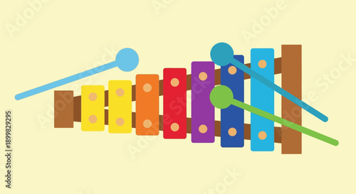 Colorful xylophone illustration with mallets on pale yellow background.
