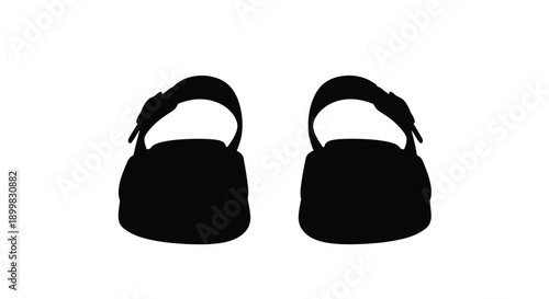 Two black shoes displayed against a white background silhouette