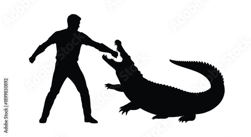 Man confronting a crocodile in a dramatic black silhouette