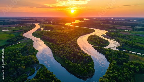 Wide river delta at sunset, magic hour glow, aerial perspective