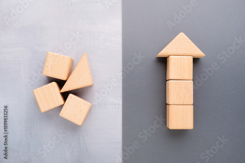 Identical wooden blocks shown as disorder on one side and organized into an upward arrow on the other