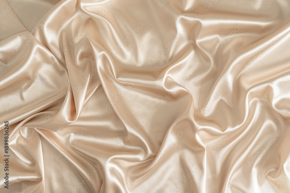 Fototapeta premium Beautiful smooth elegant wavy beige / light brown satin silk luxury cloth fabric texture, abstract background design. Copy space.