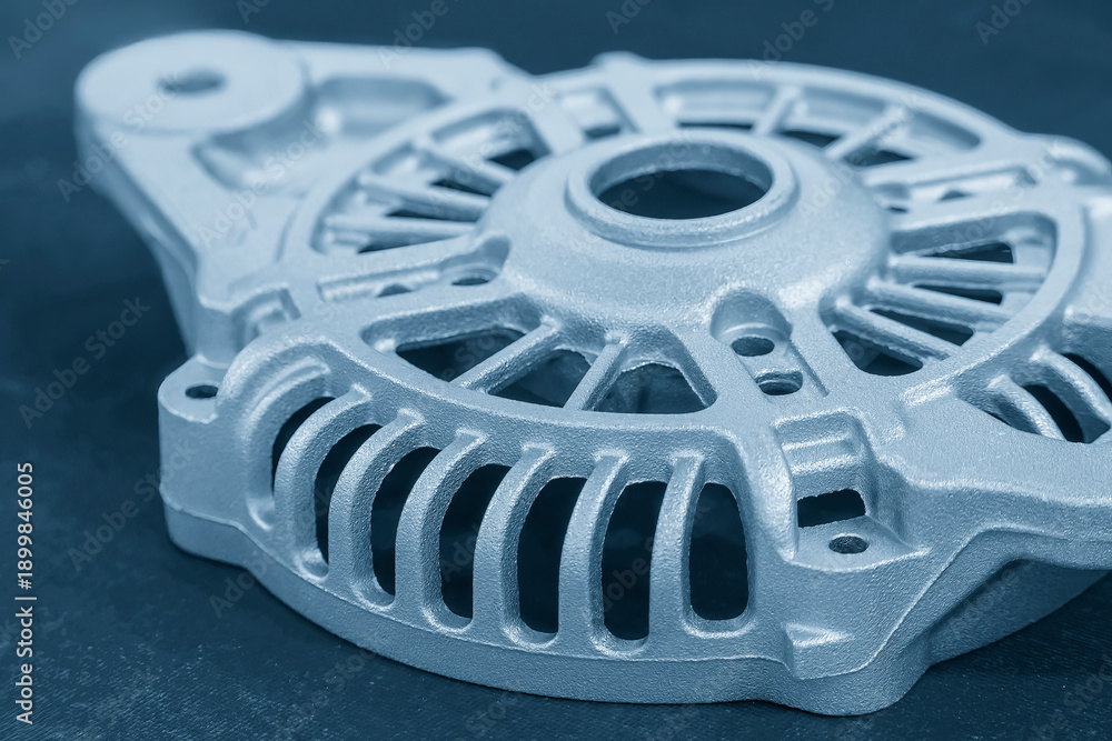 Obraz premium Close Up Aluminum Alternator Case Components for Automotive Engineering in Light Blue Scene