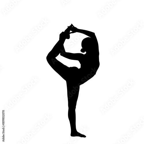 Silhouette of woman performing advanced yoga pose.
