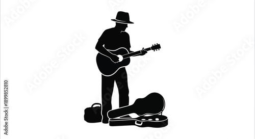 Silhouette of a musician playing guitar with an open instrument case