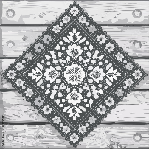 Close up of a beautiful handmade quilt featuring floral applique design and intricate stitching patterns on a wooden surface, showcasing craftsmanship and artistry.