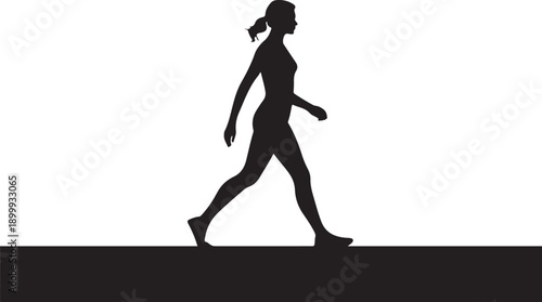 Black silhouette of a woman walking on a dark surface