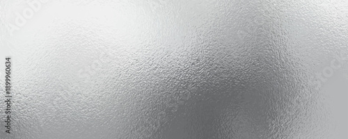 Shiny silver foil metallic texture - glossy gray steel gleaming surface, frosted glass effect with blur glare reflection, bright polished metal material.