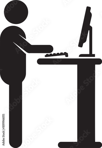 Man sitting at a desk working on a laptop computer