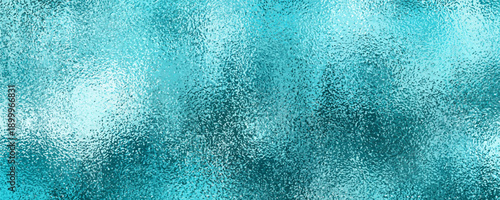 Turquoise foil texture background. Background texture of shiny turquoise foil.