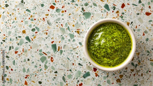 Wallpaper Mural Pesto sauce on terrazzo surface, contemporary design-driven background Torontodigital.ca