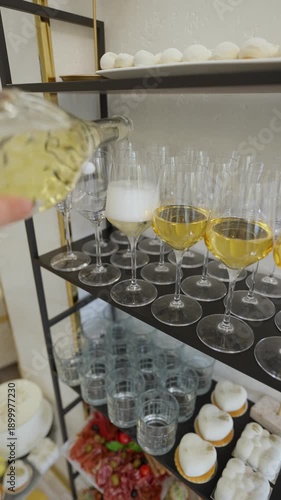 Wallpaper Mural Luxurious catering for a party with champagne pouring by the glass. The concept of a luxurious party. Torontodigital.ca