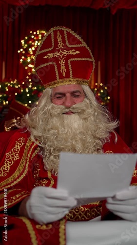 Wallpaper Mural Santa Claus is reading a letter attentively, festive Christmas atmosphere. Santa Claus concept. Torontodigital.ca