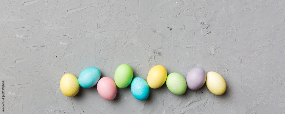 Fototapeta premium holiday preparation Multi colors Easter eggs on colored background . Pastel color Easter eggs. holiday concept with copy space