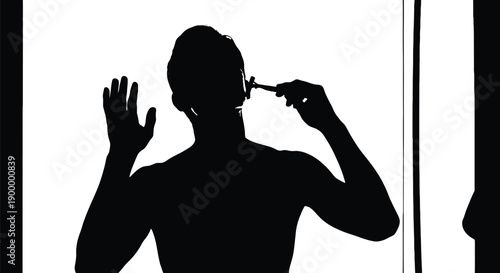 Man shaving in front of mirror with orange background