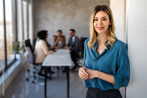 Successful executive standing proudly in office, representing business growth, partnership