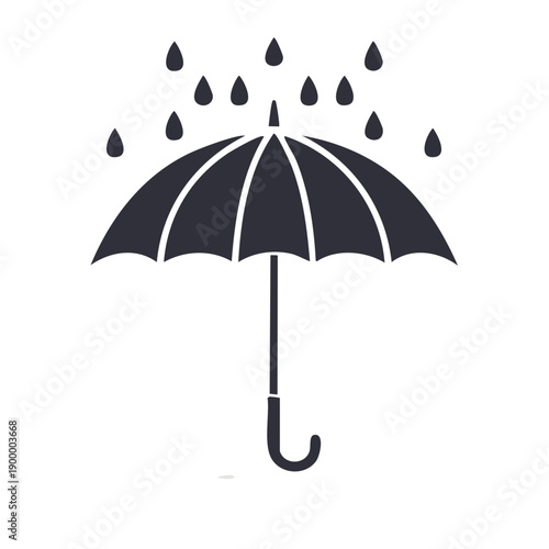 Silhouette of an open umbrella protecting from falling rain drops during a downpour