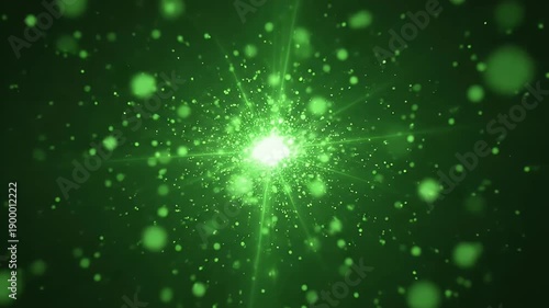 green particle burst with glowing sparks in dark backdrop