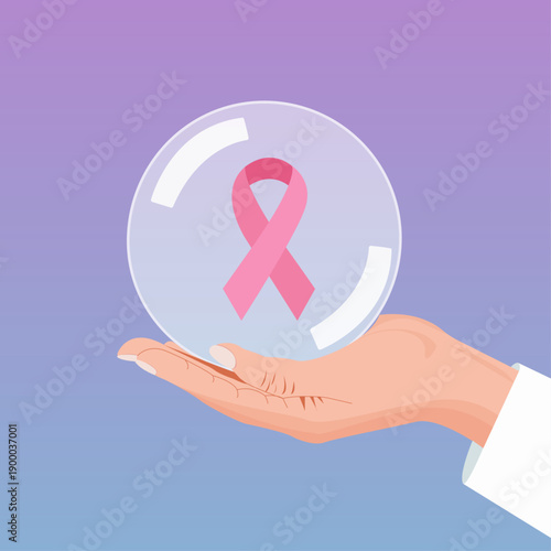 a doctor holds a transparent ball with a pink ribbon