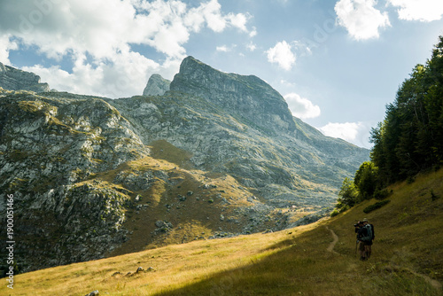 Mountain peak against a cloudy blue sky
