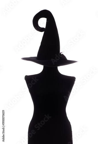 Black silhouette of a witch in a hat isolated on a white background